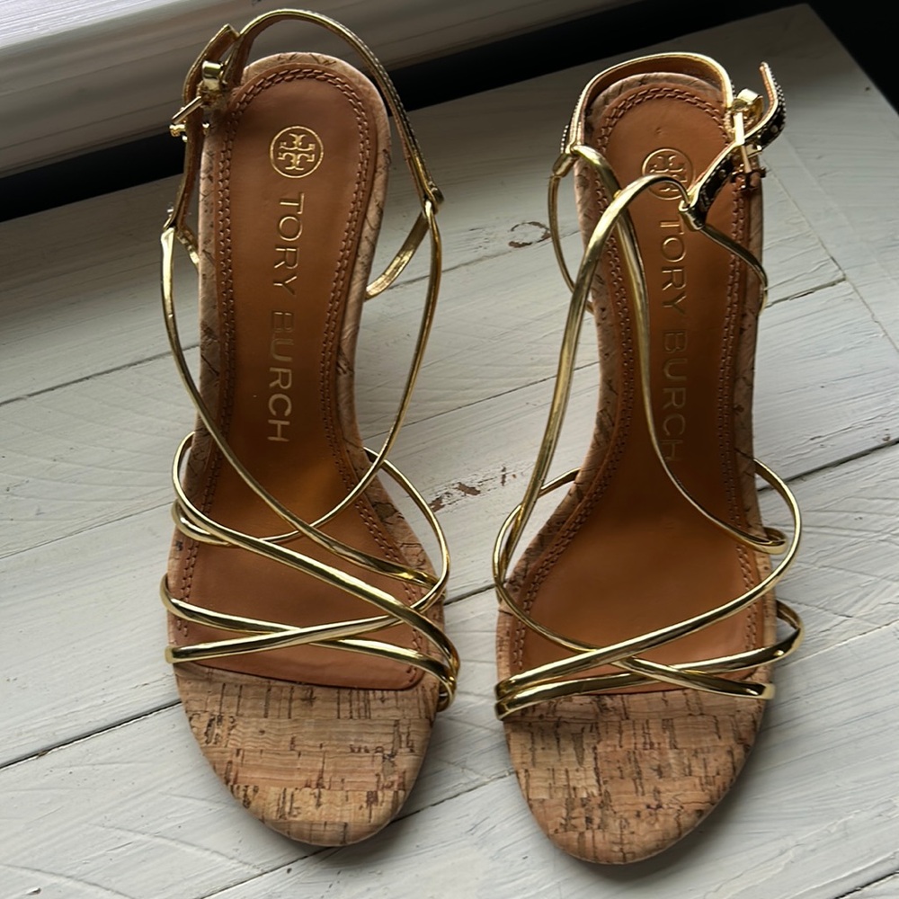Tory Burch gold sandal with cork and block heel.